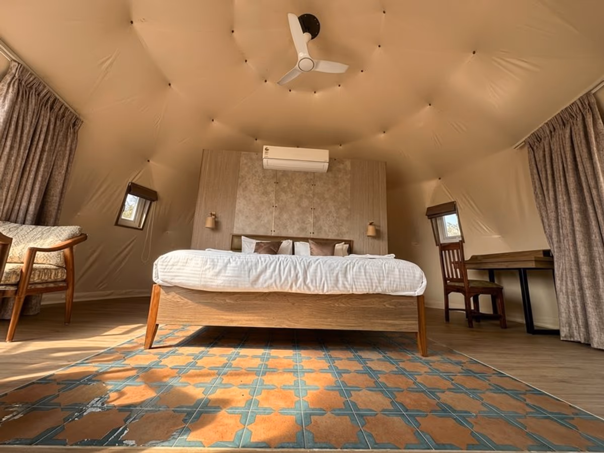 Garden Glade Getaways - wide angle dome interior with patterned tile floor and ceiling fan
