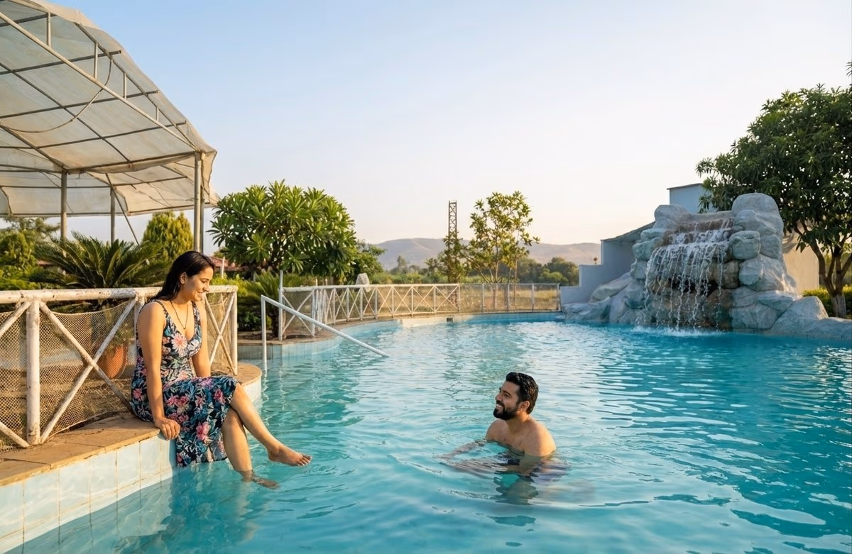 Couple relaxing by the resort swimming pool