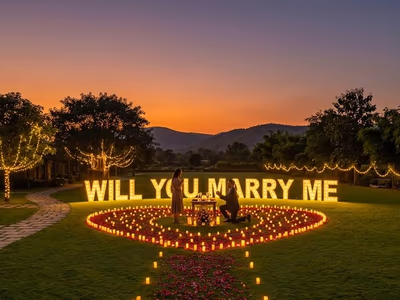 Romantic candlelit proposal setup on lawn at The Glen Woods Resort
